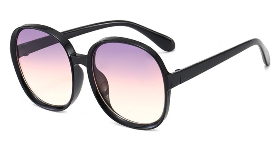 Lunettes de soleil à monture ronde pour femmes.